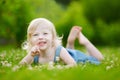 Cute little toddler girl laying in the grass Royalty Free Stock Photo