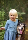 Cute Little Toddler Girl Playing Outside with her Pet Dog in the Royalty Free Stock Photo