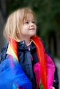 Toddler girl plays with silk scarfs