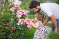 Adorable toddler girl smelling flowers Royalty Free Stock Photo