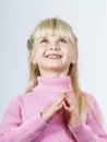 Cute little towhead girl waiting for miracle Royalty Free Stock Photo