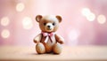 Cute little toy teddybear with pink scarf and copy space