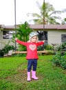 Cute little upset girl swinging Cute little girl in a red shirt is ready to swingwooden swing outdoors Royalty Free Stock Photo