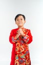 Cute little Vietnamese boy in ao dai dress smiling. Tet Holiday Royalty Free Stock Photo