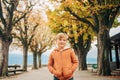 Cute little 7 year old boy posing in autumn park Royalty Free Stock Photo