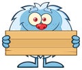 Cute Little Yeti Cartoon Mascot Character Holding Wooden Blank Sign Royalty Free Stock Photo