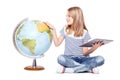cute little young girl with tablet and globe. Schoolgirl using modern technology in teaching geography