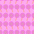 Cute lollipop on pink background. Seamless repeat pattern. Fan for kids dresses textile