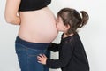 cute love first daughter kiss prenant mother belly