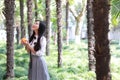 Happy cute lovely beautiful young girl high school college student hug embrace nature eat fruit orange Royalty Free Stock Photo