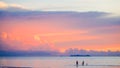 Cute lovely family walking on beach beautiful pastel sunset Royalty Free Stock Photo