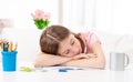 Schoolgirl sleeps on desk Royalty Free Stock Photo