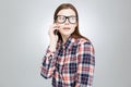 Cute lovely teenage girl in glasses talking on cell phone Royalty Free Stock Photo