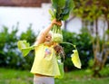 Cute lovely toddler girl with kohlrabi in vegetable garden. Happy gorgeous baby child having fun with first harvest of Royalty Free Stock Photo