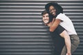 Cute, loving and affectionate interracial couple having fun, being playful and enjoying time together on copy space Royalty Free Stock Photo