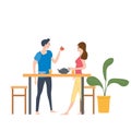 Cute loving couple at table, drinking tea or coffee and eating together at home. Daily life of cute happy couple. Male Royalty Free Stock Photo