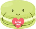Cute macaron holding a heart with the inscription I love you