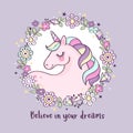 Cute magical unicorn in a flower wreath with inscription `Believe in your dreams`