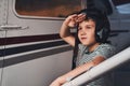 Adorable boy standing by aircraft and saluting Royalty Free Stock Photo