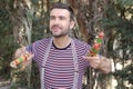 Cute male juggler practicing outdoors