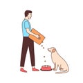 Cute male volunteer feeding stray dog in animal shelter or pound. Young man giving food to homeless or abandoned doggy