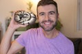 Cute man holding exotic ball python Royalty Free Stock Photo