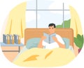 Cute man in pajamas reading literature. Book lover concept with young man lying relax on bed