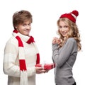 Cute man presenting christmas gift to woman