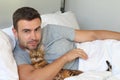 Cute man sleeping with his cat Royalty Free Stock Photo