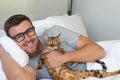 Cute man sleeping with his cat Royalty Free Stock Photo