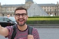 Cute man taking a selfie outdoors