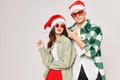 Cute man woman wearing sunglasses wearing santa hats christmas winter hugs Royalty Free Stock Photo