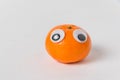 Cute Mandarin with big Googly eyes on white background. tangerine character