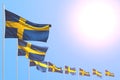 Cute many Sweden flags placed diagonal on blue sky with space for your content - any holiday flag 3d illustration