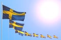 Cute many Sweden flags placed diagonal with bokeh and free space for your content - any feast flag 3d illustration