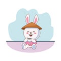 Cute mid autumn rabbit with chinese hat drinking tea