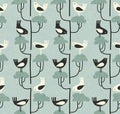 Cute mid-century style seamless pattern with birds standing on shrubs.