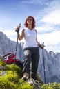 Cute middle aged female hiker resting