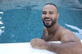 Cute Middle Eastern man swimming pool Royalty Free Stock Photo