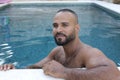 Cute Middle Eastern man swimming pool Royalty Free Stock Photo