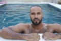 Cute Middle Eastern man swimming pool Royalty Free Stock Photo