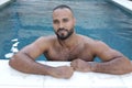 Cute Middle Eastern man swimming pool Royalty Free Stock Photo