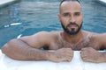 Cute Middle Eastern man swimming pool Royalty Free Stock Photo