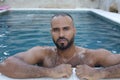Cute Middle Eastern man swimming pool Royalty Free Stock Photo
