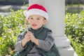 Cute Mixed Race Boy With Santa Hat and Candy Cane Royalty Free Stock Photo