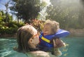 Cute mixed race little boy playing with his mother at a tropical Royalty Free Stock Photo