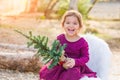 Laughing Mixed Race Young Baby Girl Holding Small Christmas Tree Royalty Free Stock Photo