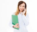 Cute, modern business woman talking on cell phone and hold folder or document case isolated on white background. Girl in shirt Royalty Free Stock Photo