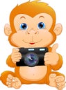 Cute monkey cartoon holding camera Royalty Free Stock Photo