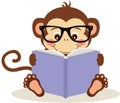 Cute monkey sitting reading a book